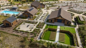 Overhead aerial image of Canopy Grove featuring the rustic barn, ceremony lawn, cocktail patio, and swimming pool in Escondido, CA.