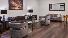 Carlsbad Windmill hospitality suite with plush seating, modern decor, and entertainment space for wedding parties.