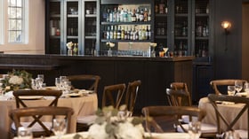 Carlsbad Windmill Loft wedding bar with premium spirits and elegant black cabinetry.