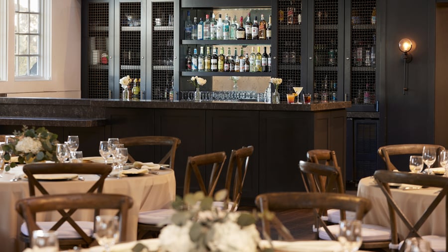 Carlsbad Windmill Loft wedding bar with premium spirits and elegant black cabinetry.