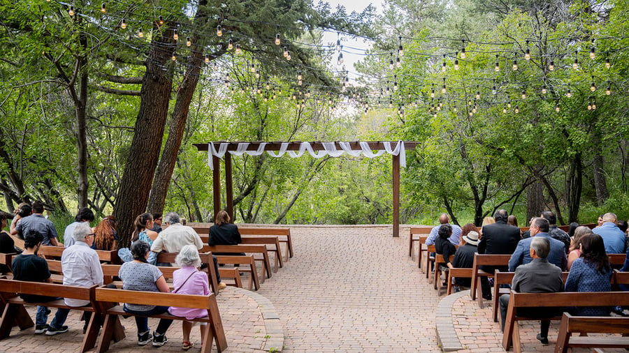 Ceremony with draping on arch - The Pines by Wedgewood Events