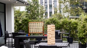 Cocktail patio with games - University Club by Wedgewood Events