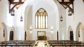 Indoor ceremony with yellow flowers - The Sanctuary by Wedgewood Events
