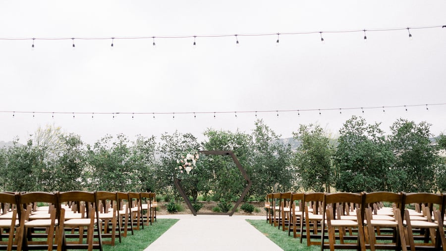 Outdoor ceremony with geometric arch - Canopy Grove by Wedgewood Events
