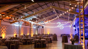 Expansive indoor reception space at Clayton House by Wedgewood Events with industrial styling