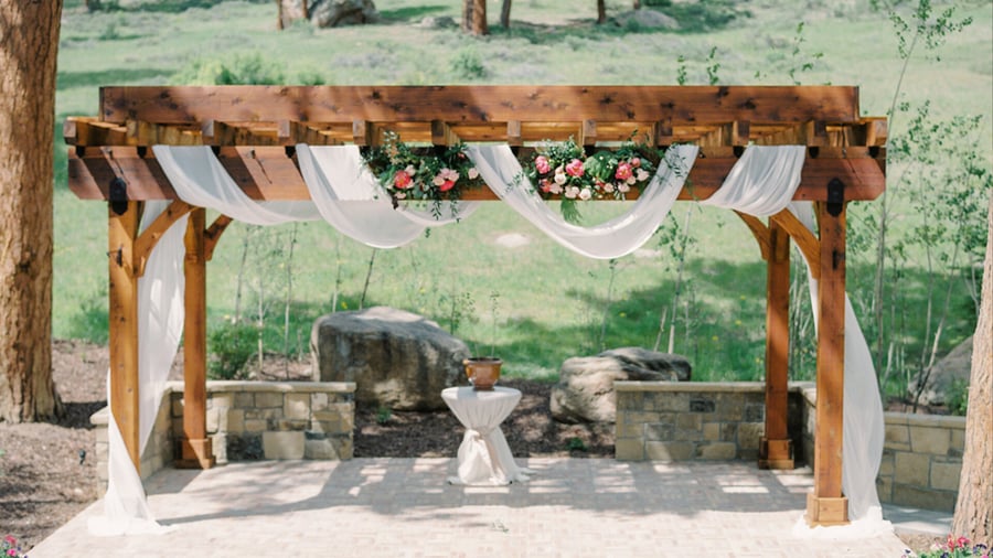 Wooden arch with draping and floral - Della Terra by Wedgewood Events