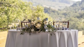 Sophisticated mountain view lounge with comfortable seating clusters, massive picture windows, and breathtaking panoramic hillside views, offering the perfect space for pre-wedding gatherings and intimate conversations