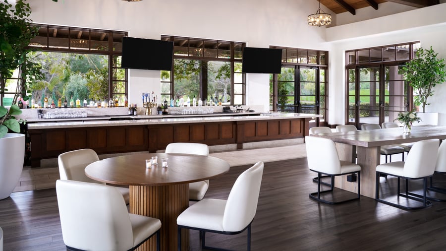 Modern event reception bar at Fallbrook Estate by Wedgewood Events featuring full service bar, contemporary seating, exposed beam ceiling and floor-to-ceiling windows for corporate events and celebrations