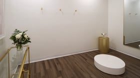Upscale event venue restroom at Fallbrook Estate Wedgewood Events featuring modern fixtures, gold accents, white roses, luxury amenities for corporate events and private celebrations in Fallbrook California