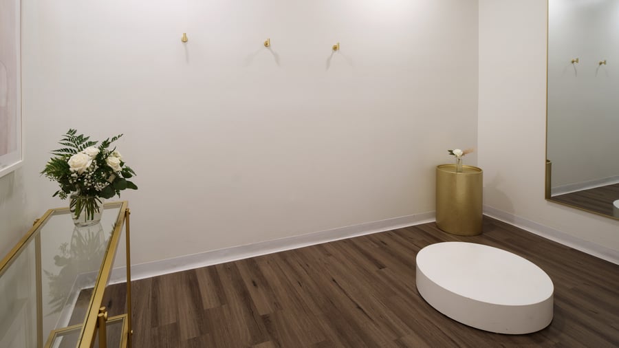 Upscale event venue restroom at Fallbrook Estate Wedgewood Events featuring modern fixtures, gold accents, white roses, luxury amenities for corporate events and private celebrations in Fallbrook California