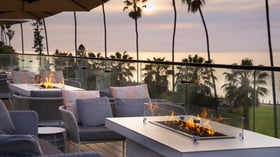  Fire pit seating area with ocean views and evening sky