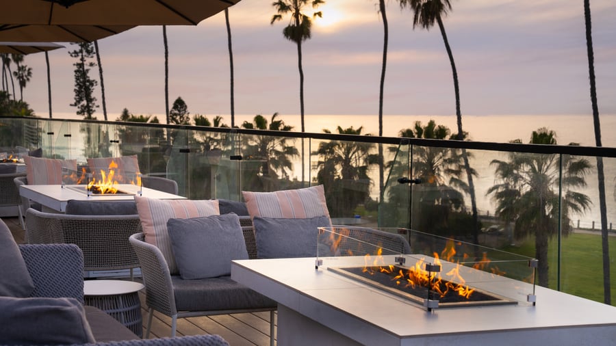  Fire pit seating area with ocean views and evening sky
