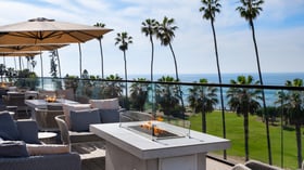  Outdoor fire pit area with modern seating and panoramic ocean views