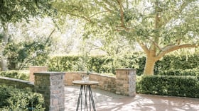 Cocktail table on stone bridge at Stonebridge Manor by Wedgewood Events