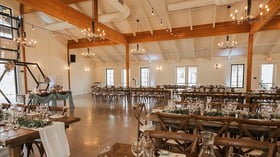 Barn style grand hall with napa style tables - Canopy Grove by Wedgewood Events