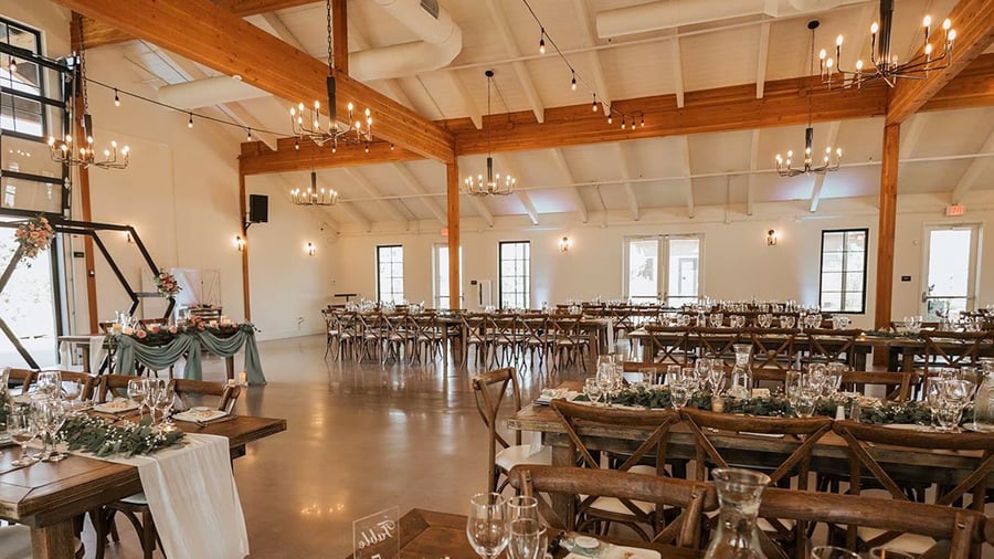 Barn style grand hall with napa style tables - Canopy Grove by Wedgewood Events