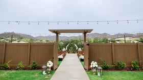 Outdoor ceremony site with mountain view - Canopy Grove by Wedgewood Events
